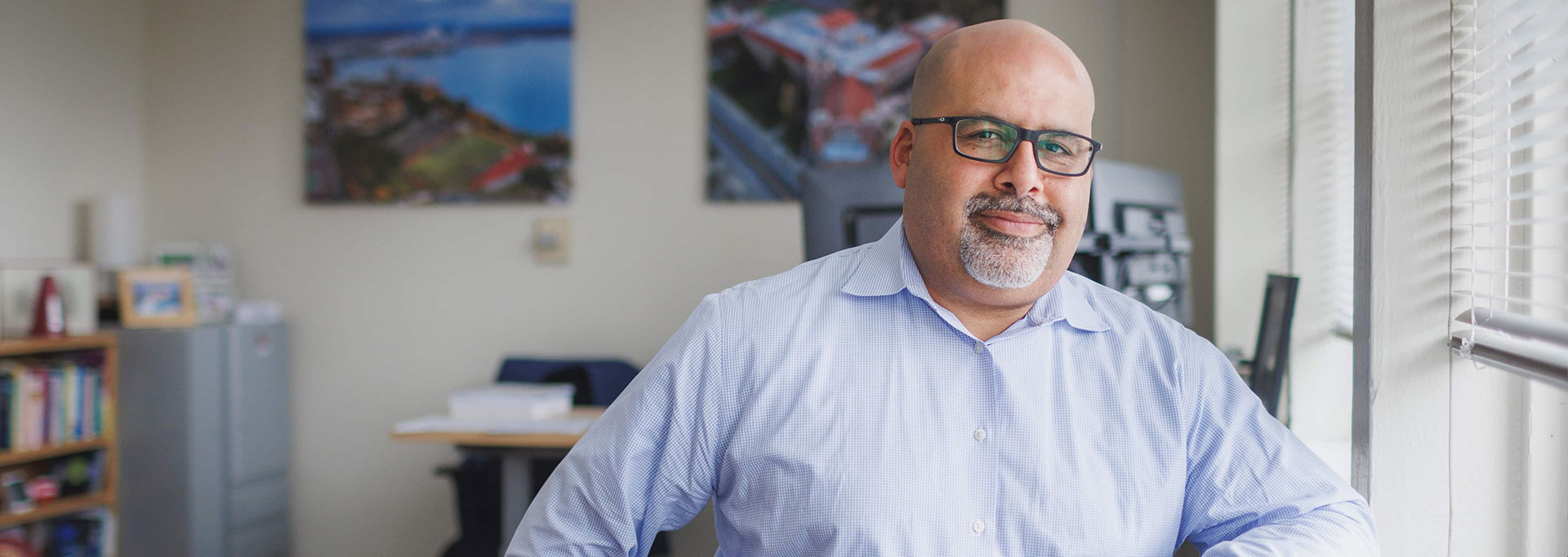 Man in office smiling