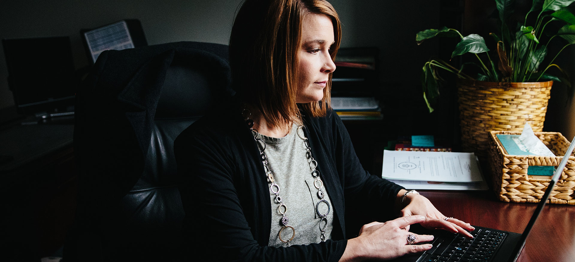 Woman viewing laptop